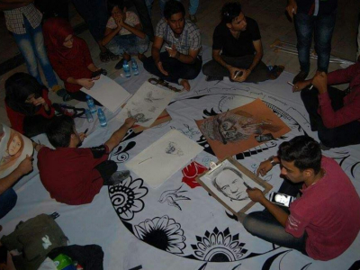 IYLEP graduates creating a piece of art to showcase at the Basra City of Peace Festival