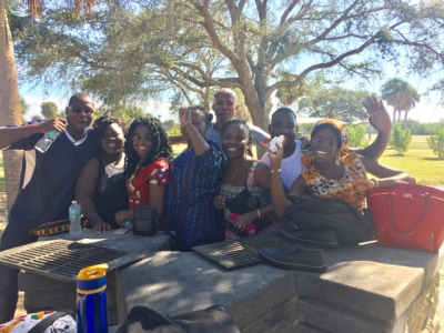 Journalists from Africa spend a Saturday volunteering in Tampa planting sea oats to prevent coastal erosion.