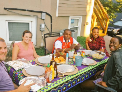 IVLP Participant from Cameroon shares a picture with his home hospitality hosts in Washington, DC