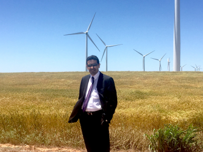 Dr. Firas Albadran examines Nextera Energy wind turbines in Oklahoma on his IVLP project