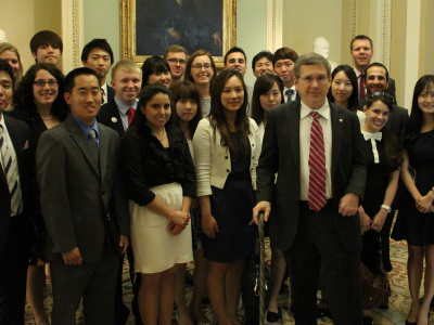 Korean and American participants in the 2013 Program meeting Senator Mark Kirk the Congressional sponsor of the exchange.