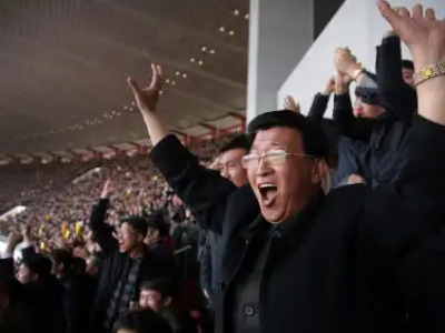 North Koreans cheer after their women’s soccer team scored their first goal against South Korea in a qualifying match for the Asian Football Confederation Cup at the Kim Il Sung Stadium on Friday, April 7, 2017, in Pyongyang, North Korea.