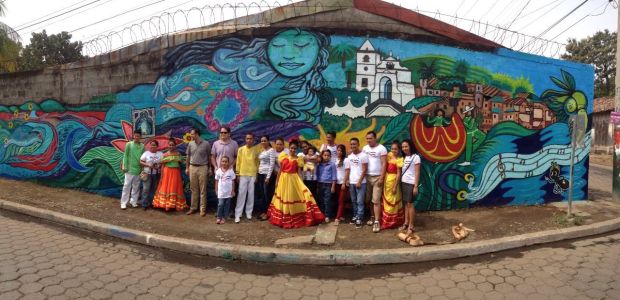 Mural exchange program participants with the El Viejo mural in Nicaragua.