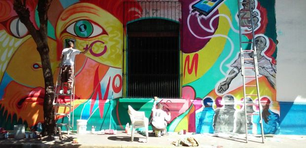 Local artists contribute to community mural in León, Nicaragua.