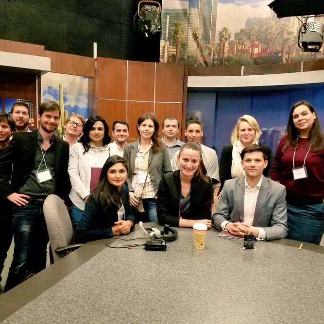 European Murrow group gathers behind the KPNX TV Phoenix News Desk during a station tour.
