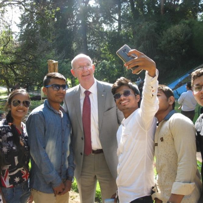Dr. Mark Bucknam, Professor at the National War College posing for selfie at request of young Indians at Government Botanical Gardens in Tamil Nadu