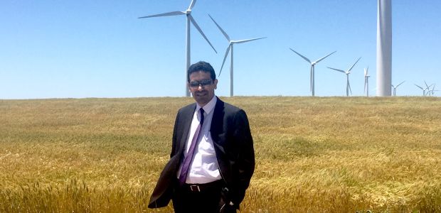 Dr. Firas Albadran examines Nextera Energy wind turbines in Oklahoma on his IVLP project