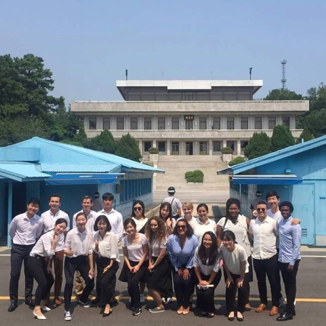 Korean and American Participants at the DMZ. North Korea is visible in the backgorund.