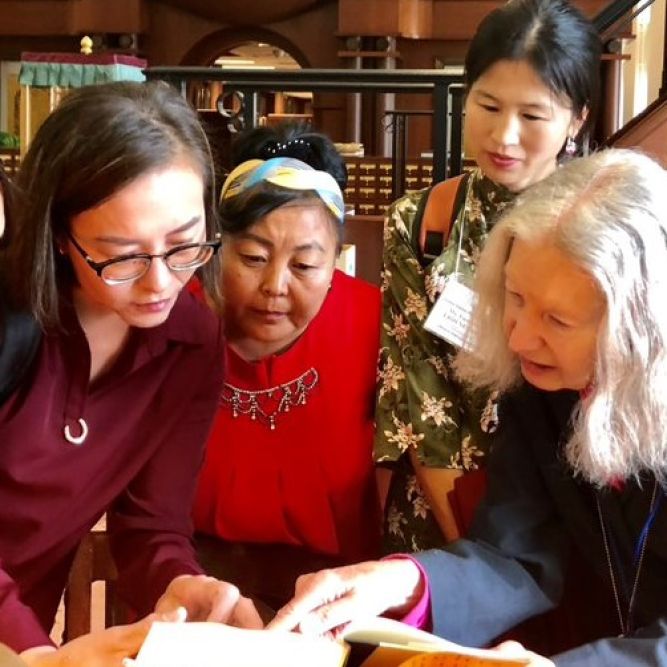 Participants from the IVLP "Library Management" program from Mongolia pour over the University of Iowa's collection during their visit in October.