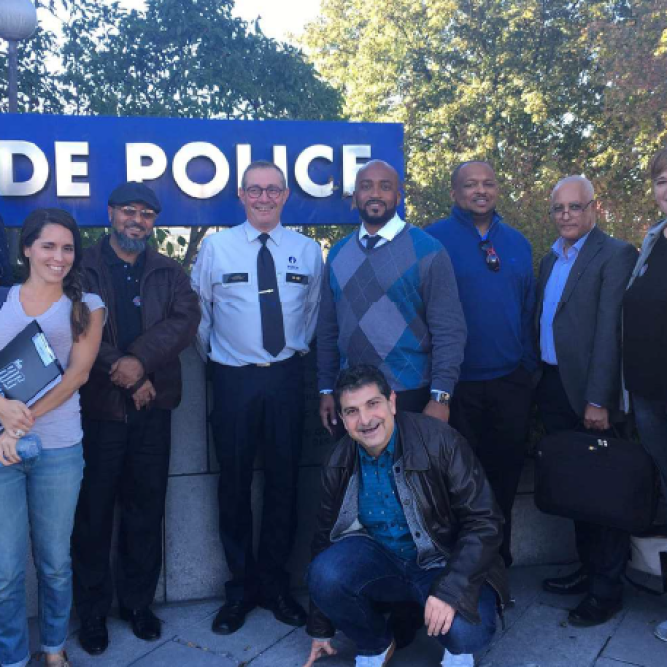Manuel Comeron (bottom) pictured with the American delegation meeting with the Liège Police Force during the Community Connections program