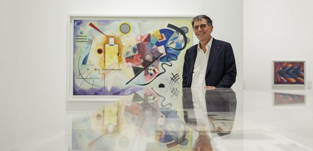 Serge Lasvignes, president of the Pompidou Center, in the Shanghai museum. Behind him is Vasily Kandinsky’s “Gelb-Rot-Blau.”