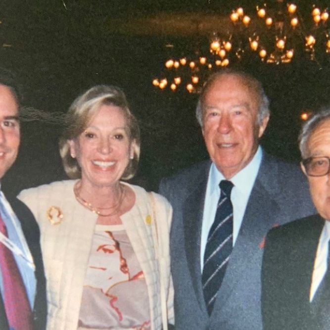 Ambassador Stuart Holliday, CEO of Meridian (left), George Shultz, former Secretary of State (center right)