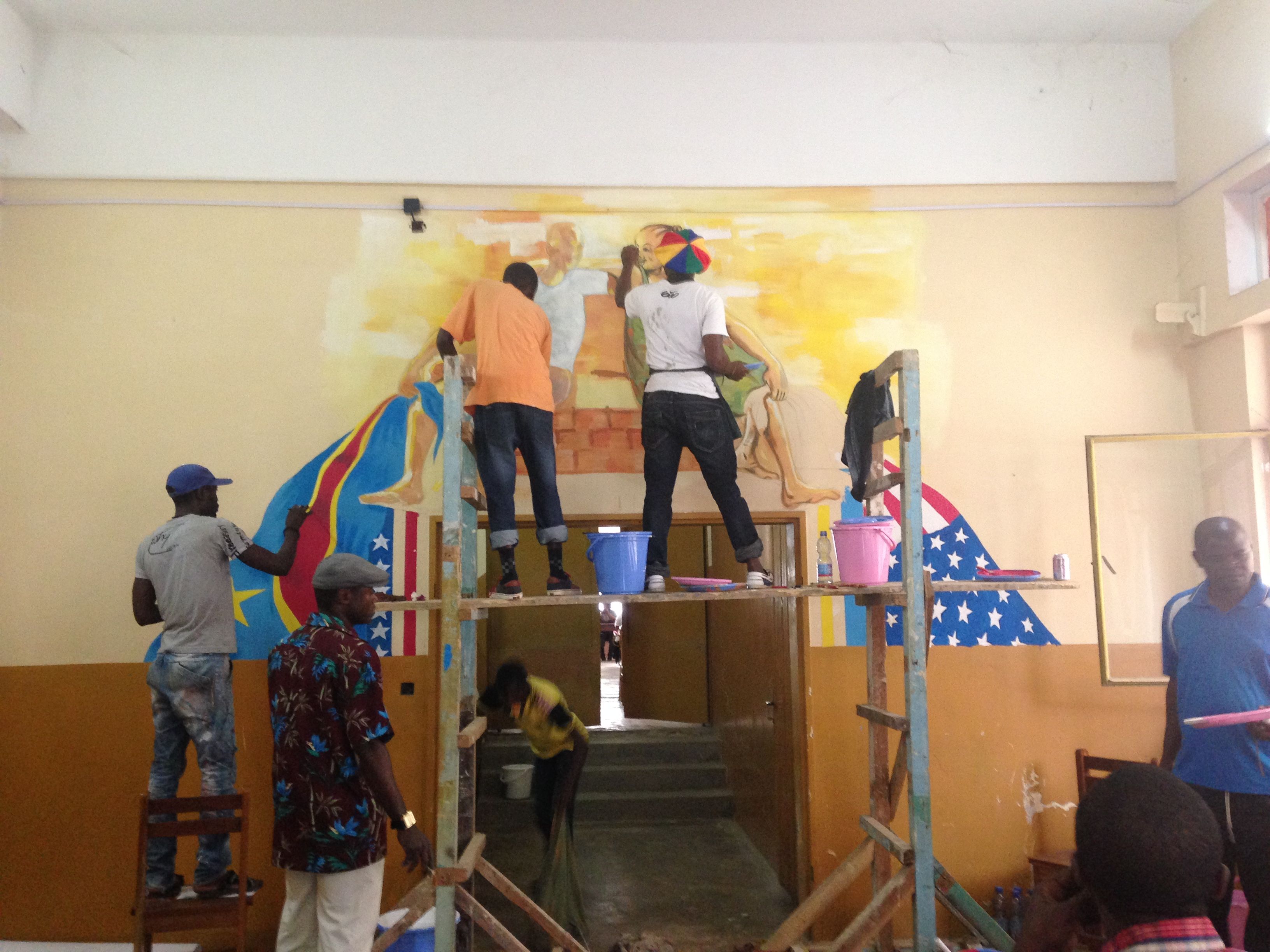 Local artists helping with the Matadi mural at the American Shelf.