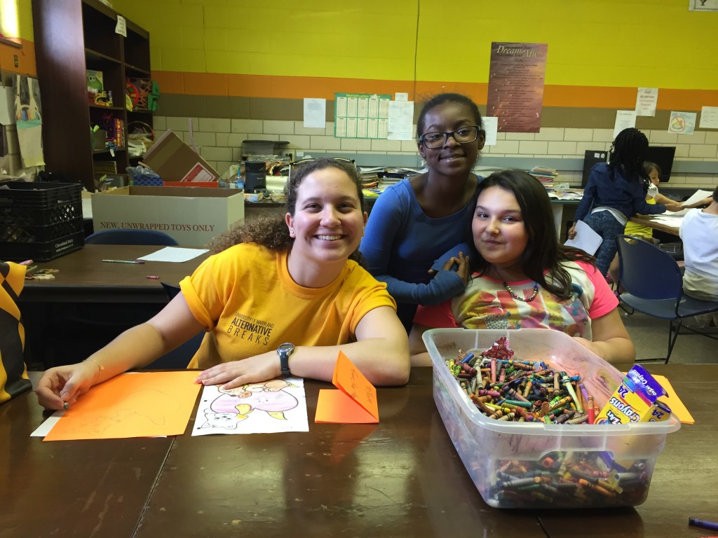Tessa Trach, University of Maryland student, with girls at the Boys and Girls Club of Huntington.