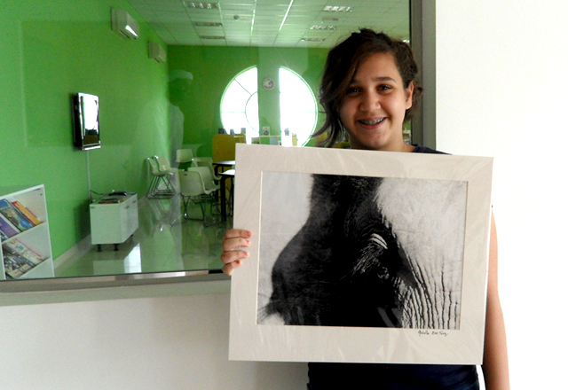 A FUNN participant creates a charcoal drawing during an art workshop dedicated to children/Courtesy of FUNN.