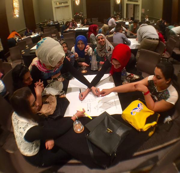 Students from the Iraqi Youth Leadership Exchange Program work together on a group project.